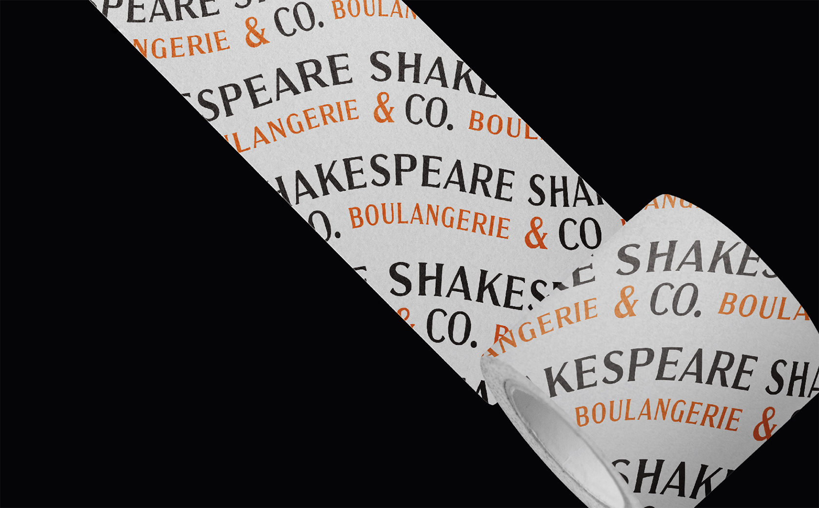 印有黑色與橘色 SHAKESPEARE & CO. BOULANGERIE 字樣的品牌膠帶